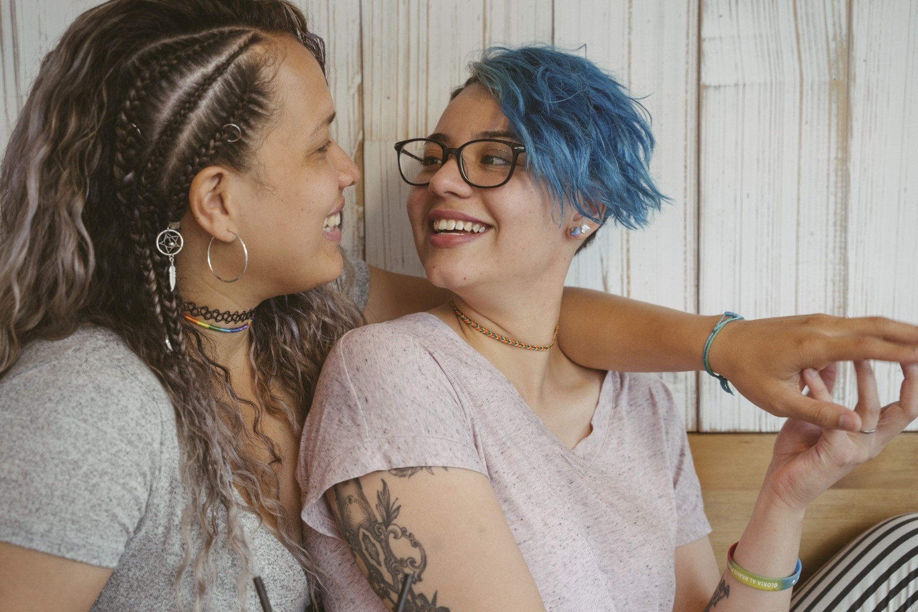 A lesbian couple smiling and laughing